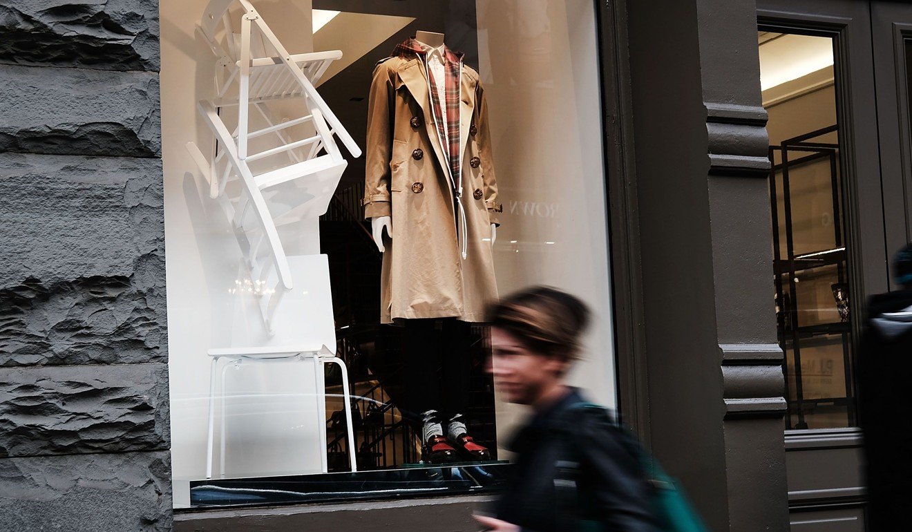 An iconic Burberry trench coat is displayed in a window of a Burberry store in New York City. Photo: AFP