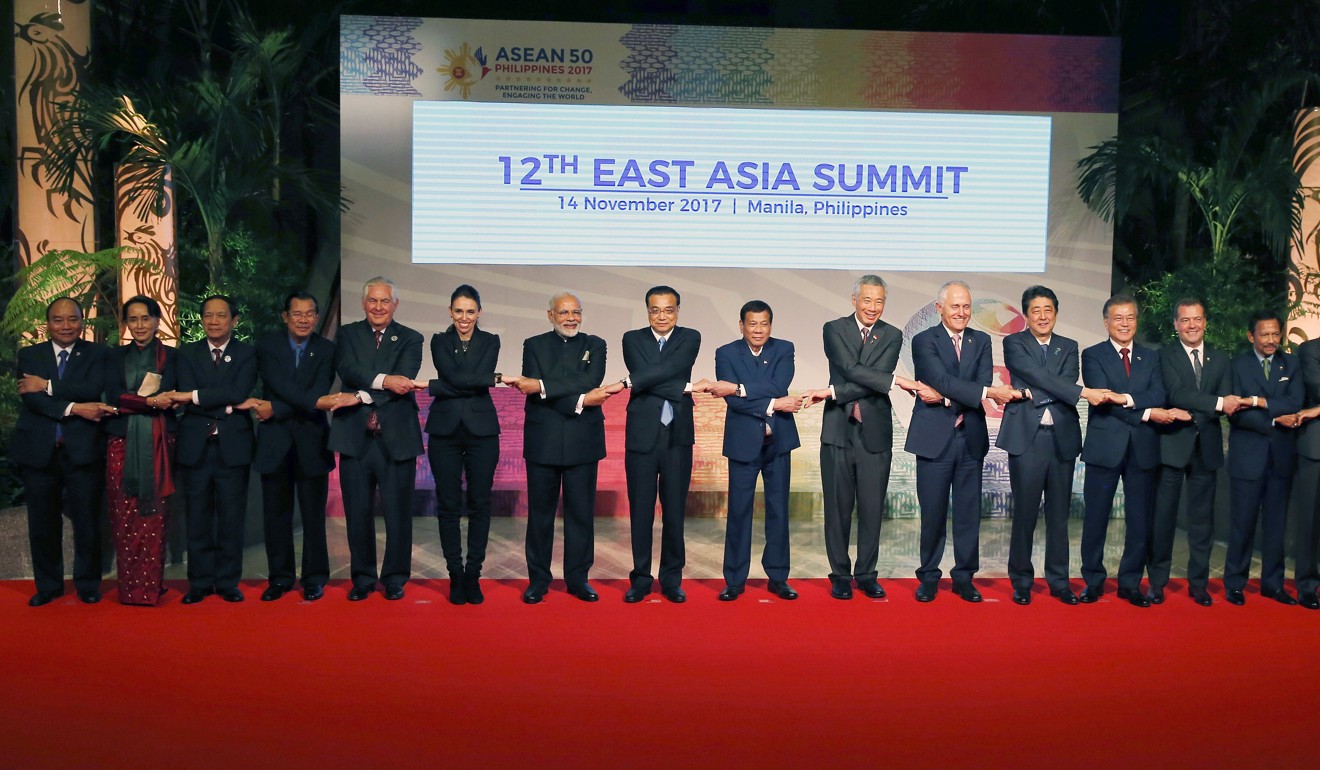 Regional leaders join hands for the East Asia Summit in Manila on Tuesday. Photo: EPA