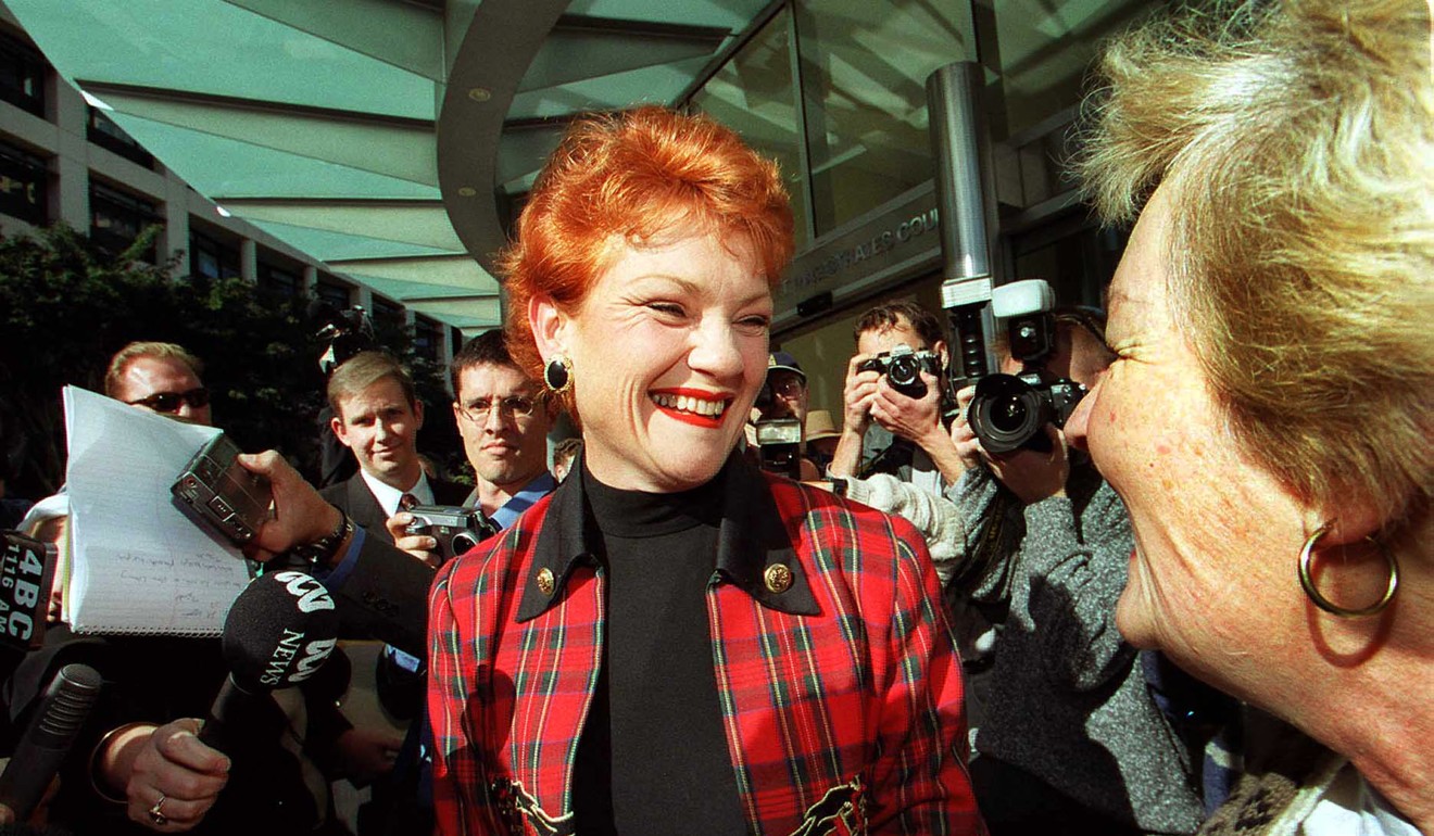 Pauline Hanson in 2001, outside the Brisbane Magistrates Court, when she was released on bail after being charged with electoral fraud. Photo: Reuters