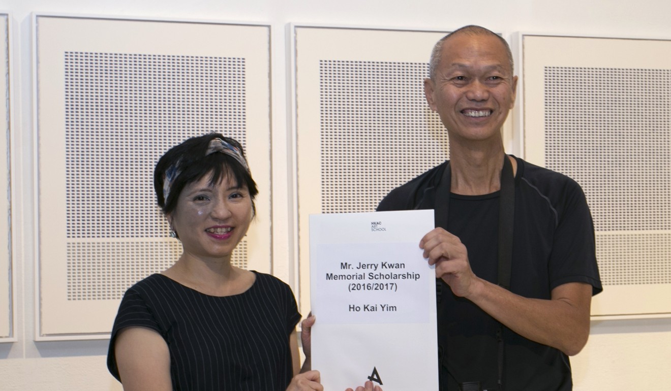 Ho receiving the Jerry Kwan Memorial Scholarship from Hong Kong Arts Centre executive director Connie Lam. Photo: Handout