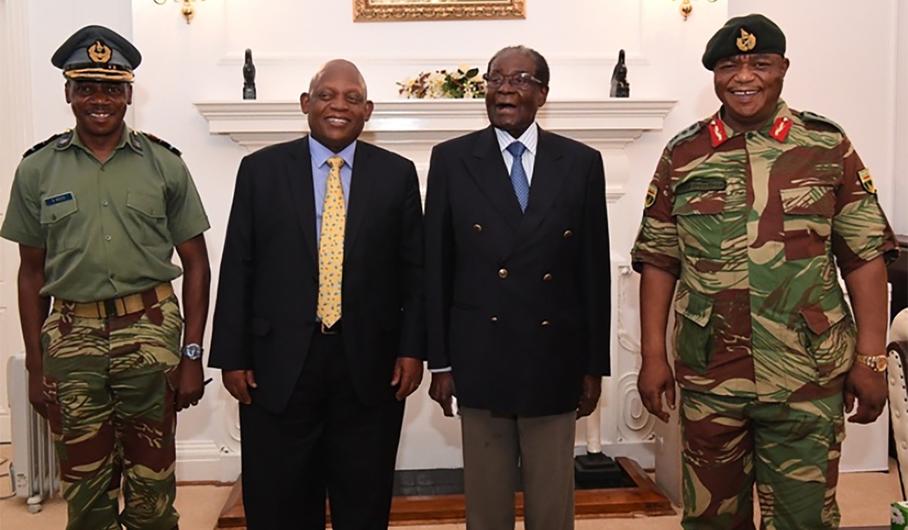 Robert Mugabe (second right) with Defence Forces Commander General Constantino Chiwenga (right) and South African envoys at State House in Harare. Photo: Agence France-Presse