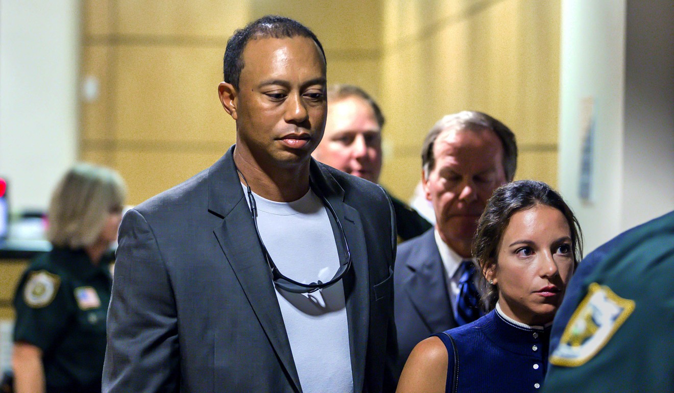 Tiger Woods leaves the Palm Beach County Courthouse after pleading guilty to a charge of reckless driving in connection with his May arrest for driving under the influence. Photo: AP