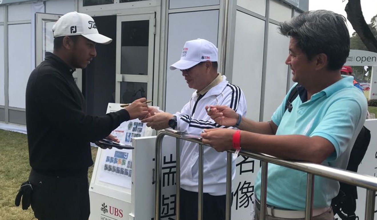 D'Souza signs autographs for some fans after making the UBS Hong Kong Open cut.
