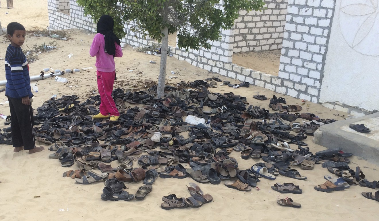 Discarded shoes of victims outside Al-Rawda Mosque. Photo: AP