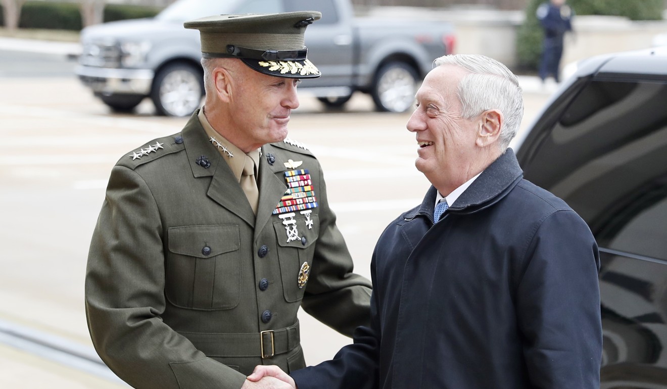 Chairman of the Joint Chiefs of Staff General Joseph Dunford (left) shakes hands with Secretary of Defence James Mattis on January 21 in Washington. Mattis, along with Chief of Staff John Kelly and National Security Adviser H.R. McMaster, have been termed “the adults” in the Trump administration due to their experience and rationality, and Dunford has contradicted Trump on issues such as the Iran nuclear deal. Photo: AP