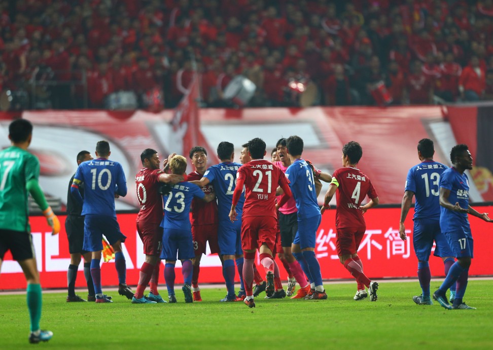 A brawl breaks out between Shanghai SIPG and Shenhua players during a fiery Cup final. Photo: AFP
