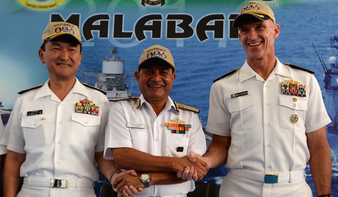 Japanese Rear Admiral Hiroshi Yamamura (left), US Rear Admiral William Byrne (right) and HCS Bisht, vice-admiral of the Indian Navy (centre), pose during the inauguration of joint naval exercises with the United States and India in Chennai on July 10. India began holding naval exercises with the United States and Japan off its south coast on July 10, seeking to forge closer military ties to counter growing Chinese influence in the region. Photo: AFP