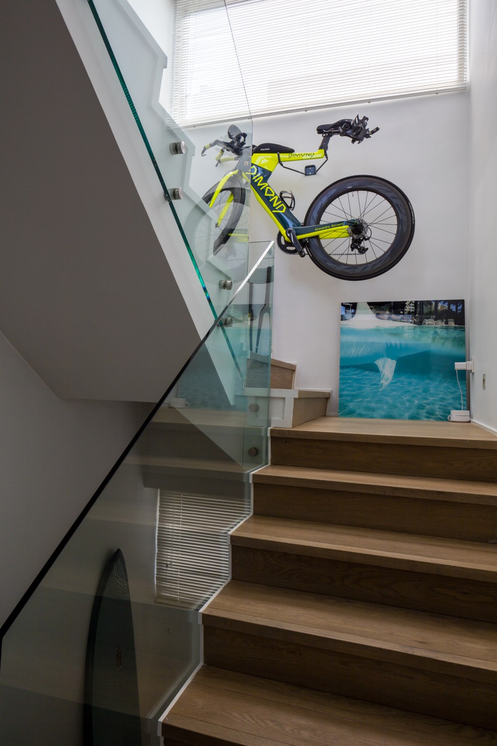 Tania Reinert makes most of the space by propping her husband’s bikes on racks in the stairwell.