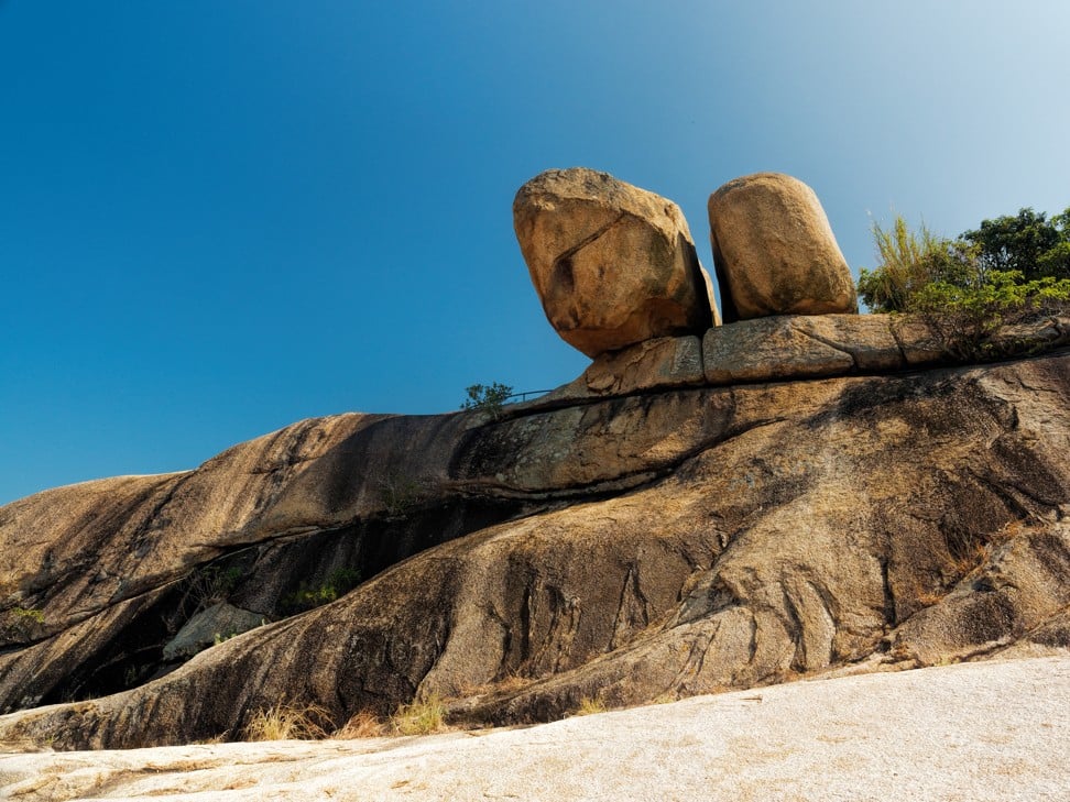 Reclining Rock is actually a pair of boulders overhanging a rocky slope. Photo: Martin Williams