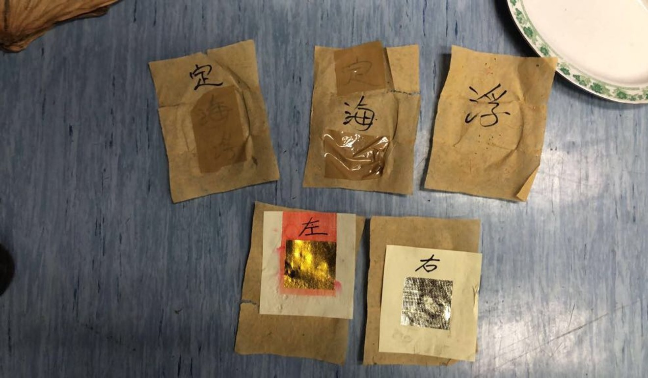Materials associated with triad initiation confiscated in the raids on the Wo Shing Wo triad hideout. Photo: HANDOUT