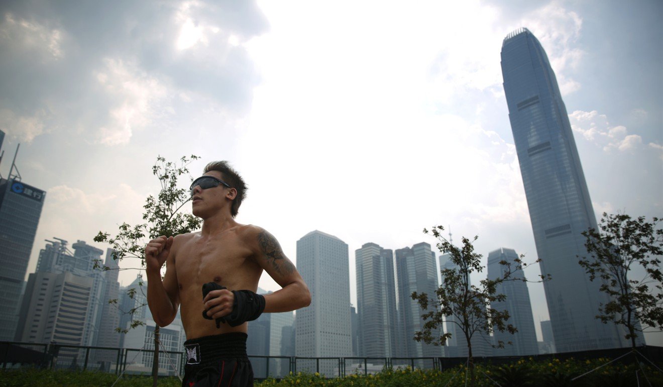 A man running in Central on August 22, when the highest temperature in Hong Kong was recorded. Photo: Sam Tsang