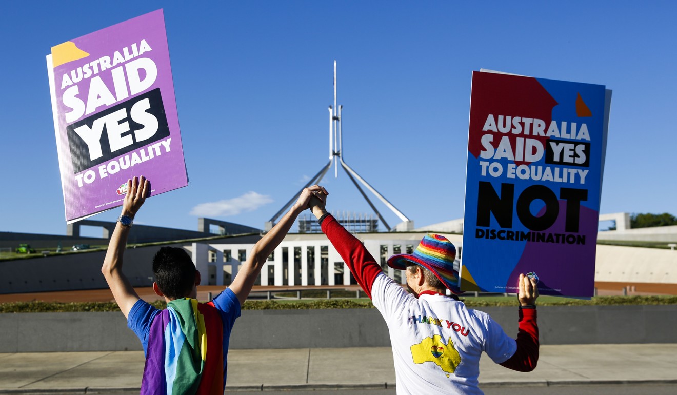 Supporters of same-sex marriage celebrate in front of Parliament House in Canberra. Photo: AFP