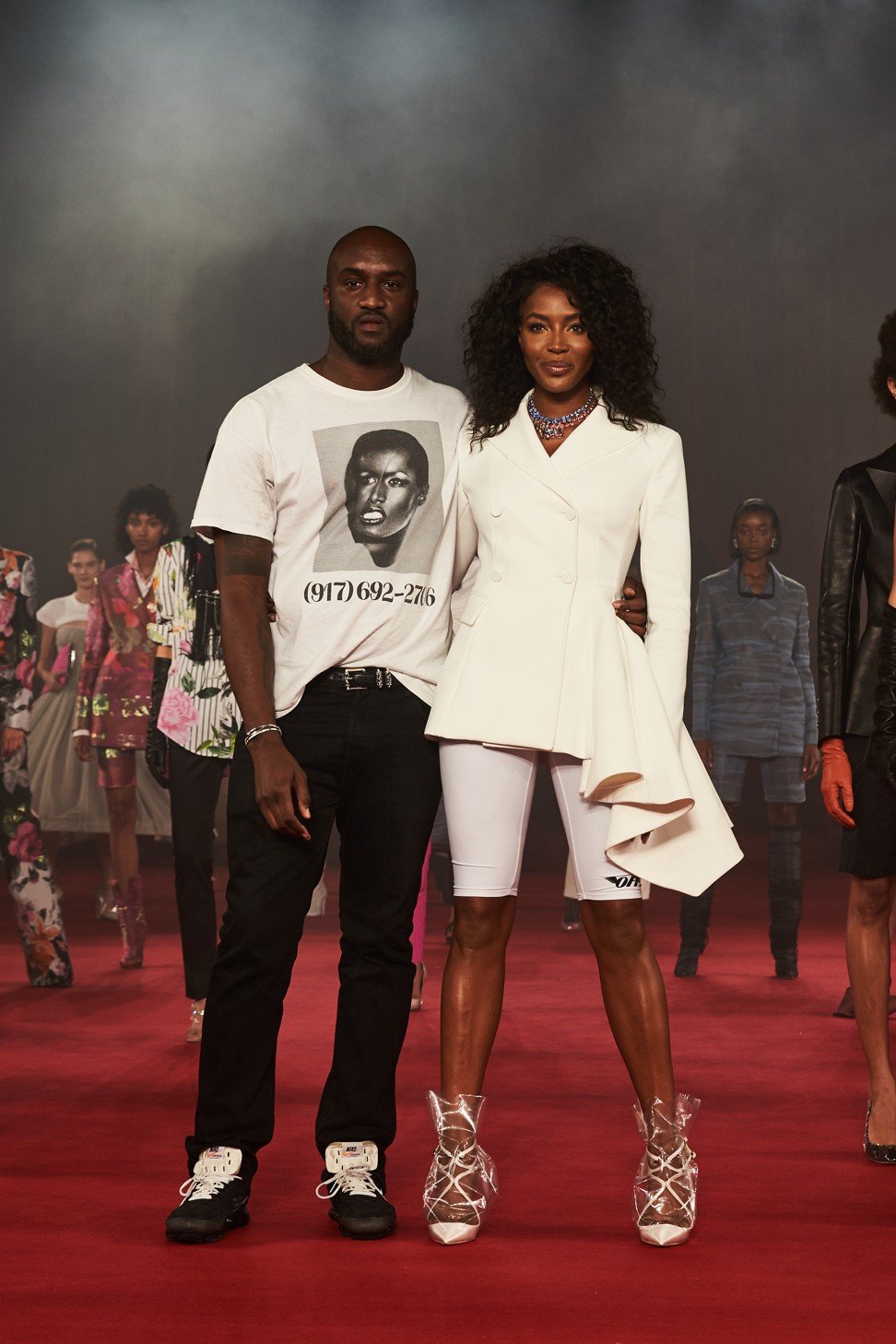 Off-White founder Virgil Abloh (left) and Naomi Campbell at the finale of Off-White’s spring/summer 2018 show. Campbell’s shoes are made in collaboration with Jimmy Choo.