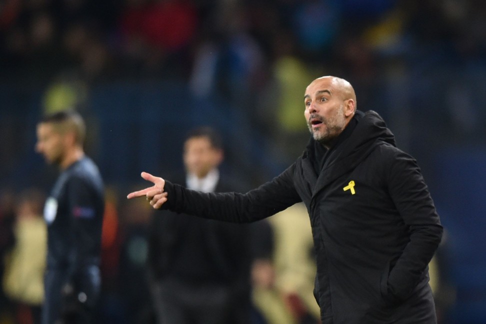 Manchester City manager Pep Guardiola coaches from the sidelines of his team’s Uefa Champions League loss to Shakhtar Donetsk. Manchester United boss Jose Mourinho has questioned Guardiola’s sporting of a yellow ribbon in support of Catalan independence. Photo: AFP