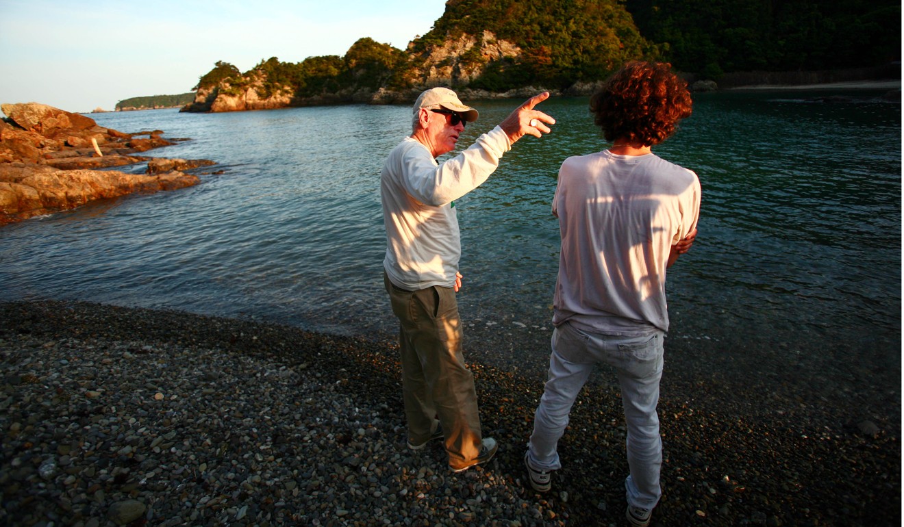 File photo of marine mammal specialist Ric O’Barry (left) on a beach near the cove in Taiji. Photo: AP
