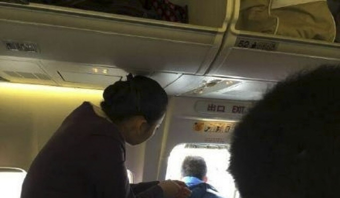 Image of an airline passenger on board an internal flight in China who sparked a safety scare in December 2014 by yanking open an emergency exit just before a plane was due to take off to ‘get some fresh air’.