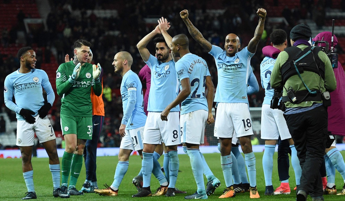 Manchester City celebrate witht he away fins after their victory opened up an 11-point lead in the Premier League. Photo: AFP