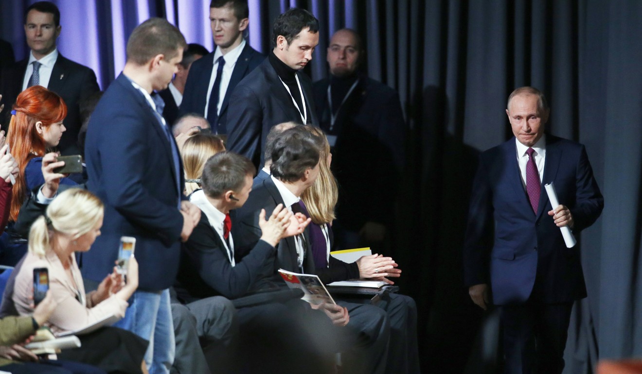 Russian President Vladimir Putin arrives for his annual news conference. Photo: EPA