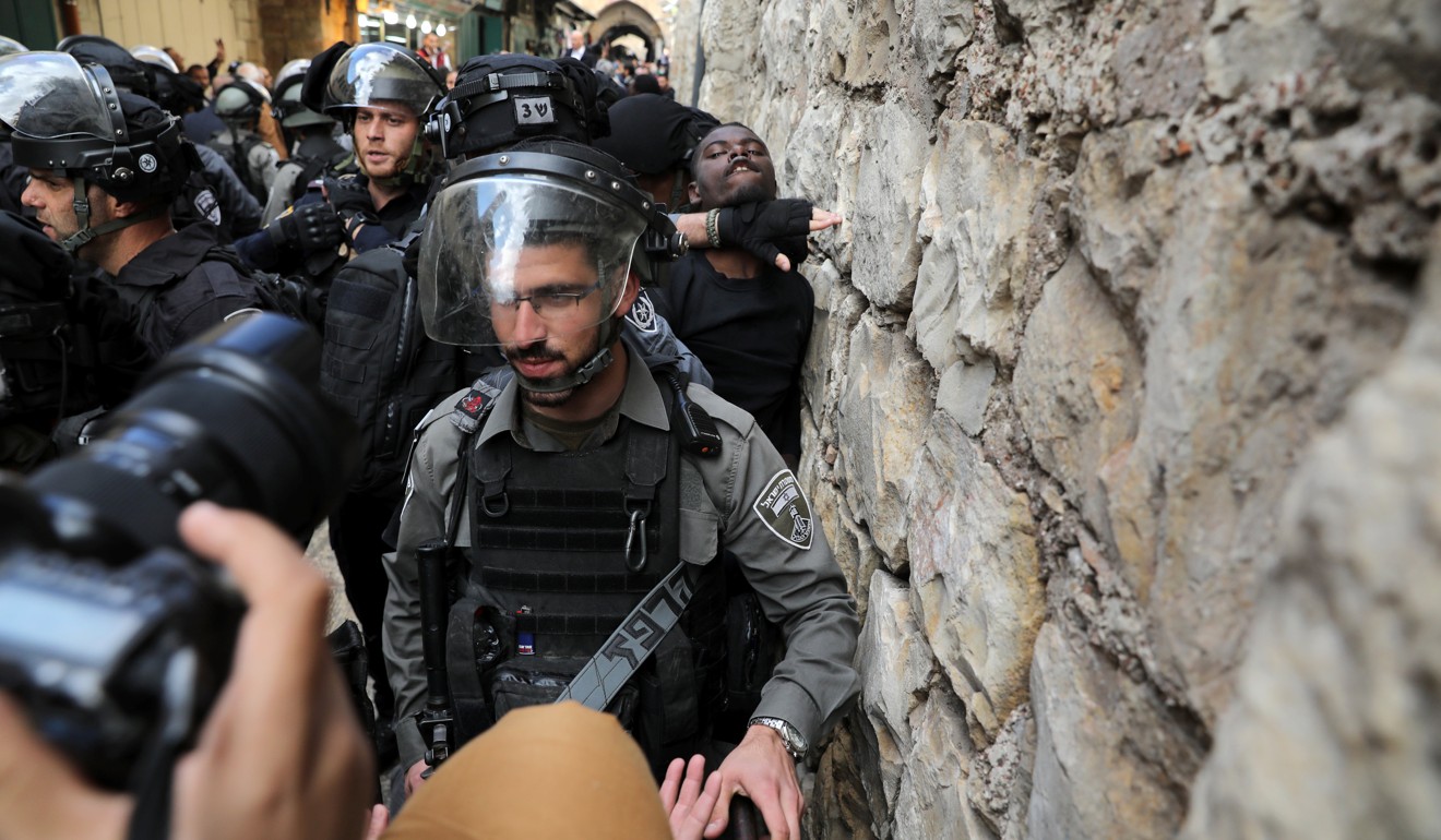 Israeli police officers detain a Palestinian protester after Friday prayers in Jerusalem's Old City. Photo: Reuters