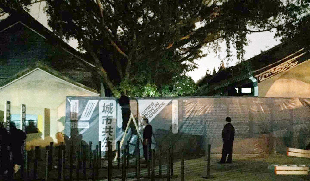 By night time the mural had been covered up with a banner. Photo: SCMP