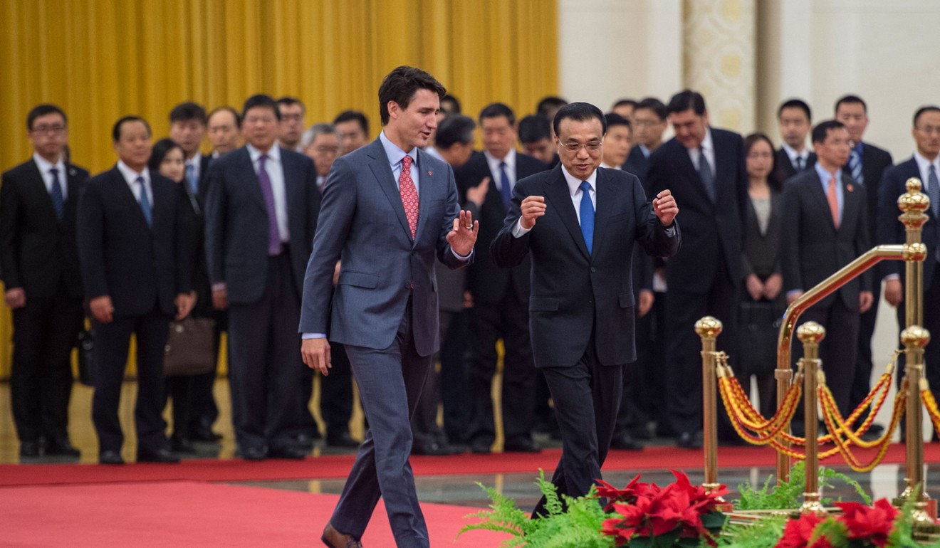 Canadian Prime Minister Justin Trudeau and China's Premier Li Keqiang walk together during a welcoming ceremony at the Great Hall of the People in Beijing on December 4. Trudeau and Li signed three trade agreements on December 4 as Canada seeks to diversify commercial ties amid tough Nafta negotiations. Photo: AFP