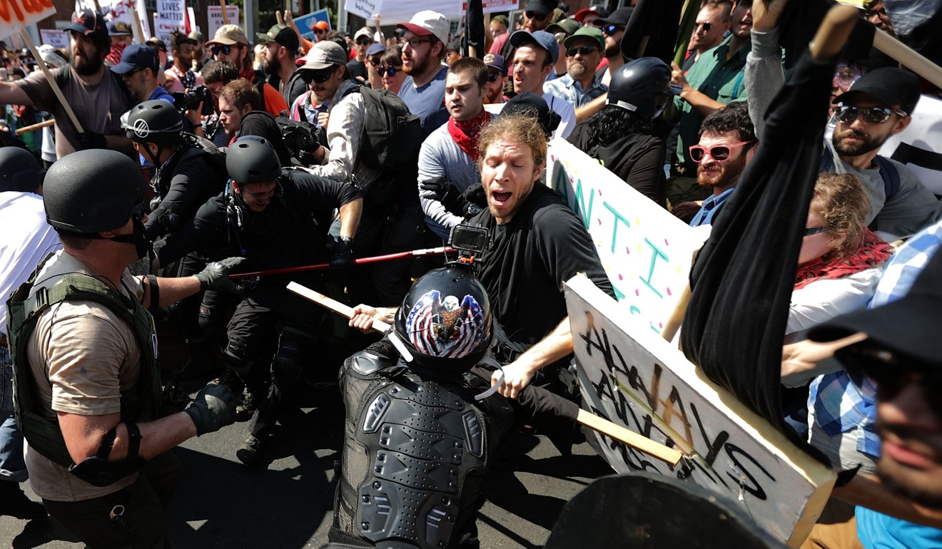 White nationalists, neo-Nazis and members of the “alt-right” (L) clash with counter-protesters in Charlottesville, Virginia. Photo: Getty Images/AFP
