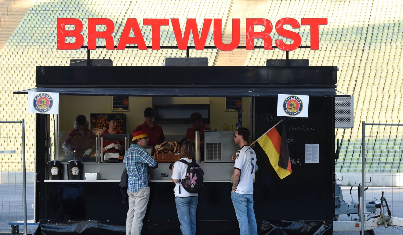 This file photo taken on July 07, 2016 shows German supporters in front of a sausage stand before a Euro 2016 semi-final football match in Munich, southern Germany. Photo: Agence France-Presse