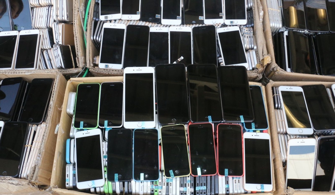 A total of 8,500 phones, both new and used, were found in the 40 boxes of goods loaded on the speedboat. Photo: Handout