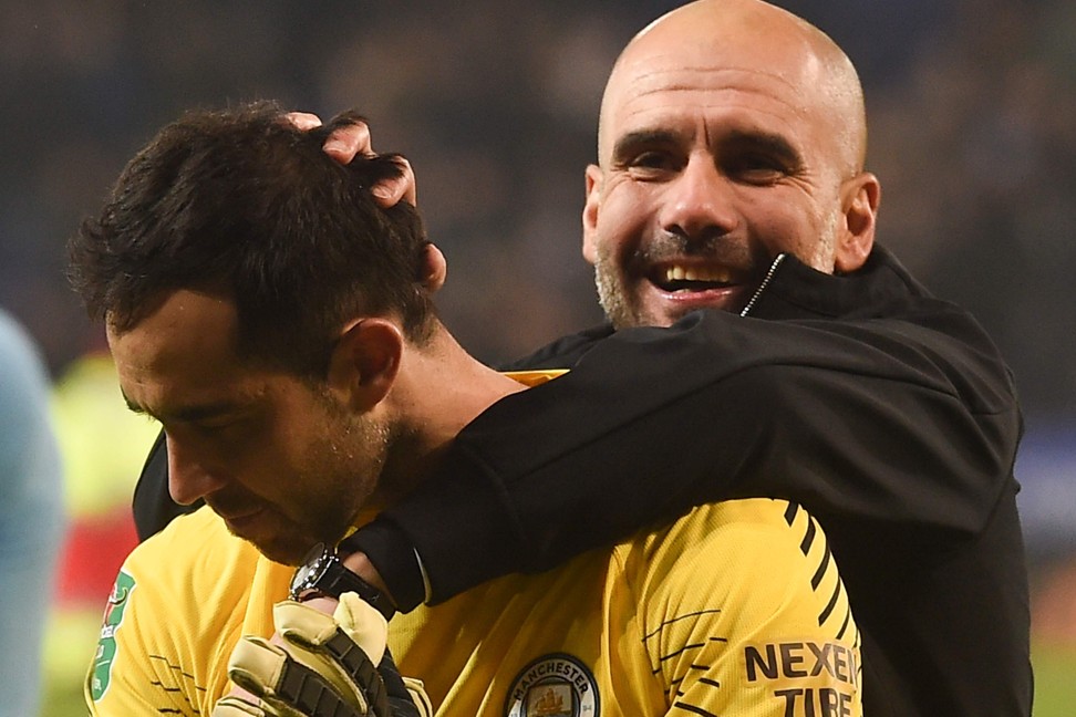 Manchester City manager Pep Guardiola celebrates with shoot-out hero Claudio Bravo. Photo: AFP