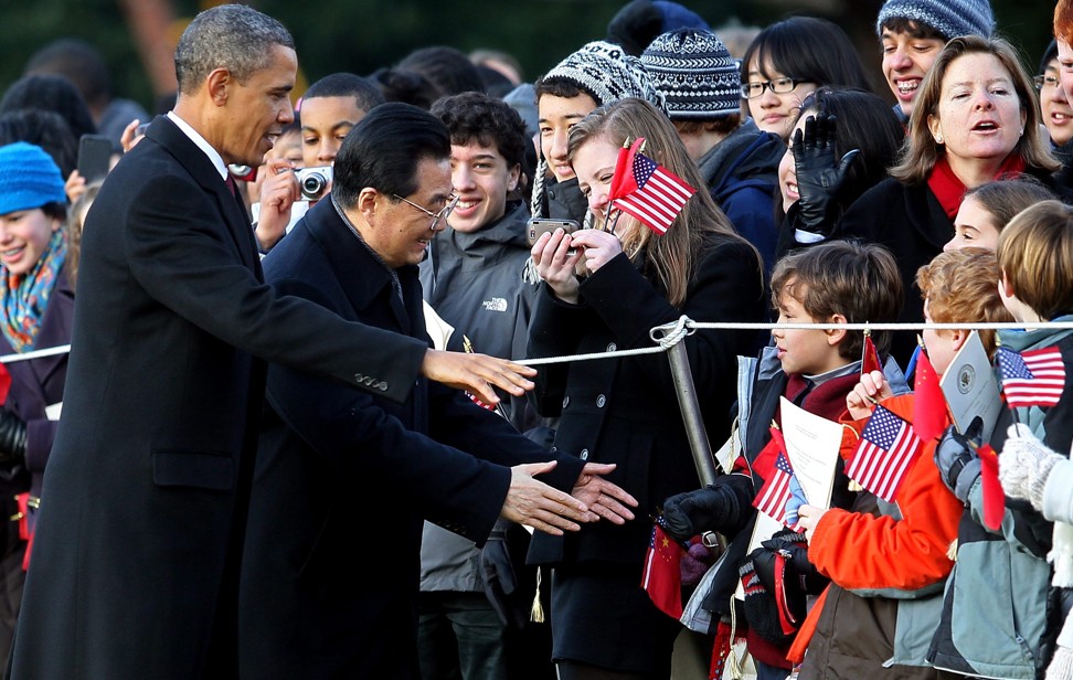 US President Barack Obama (left) greets children with Chinese President Hu Jintao on the South Lawn of the White House in January 2011. During his visit, Hu spoke of China’s “remarkable achievements” but said the country still had “a long way to go”. Photo: EPA