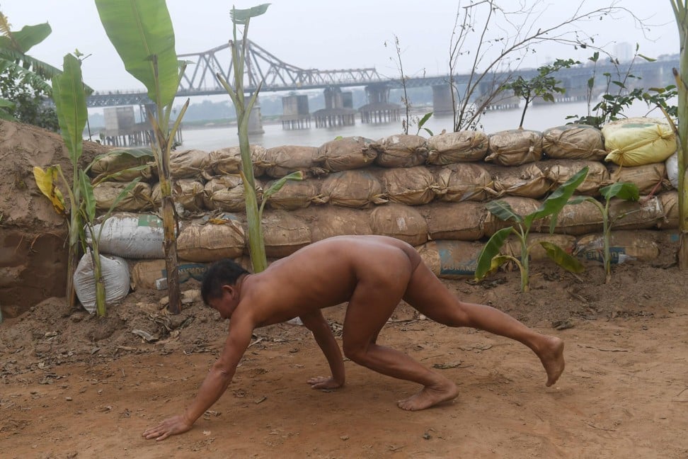Some nudists swim, some jog – some perform military drills. Photo: AFP