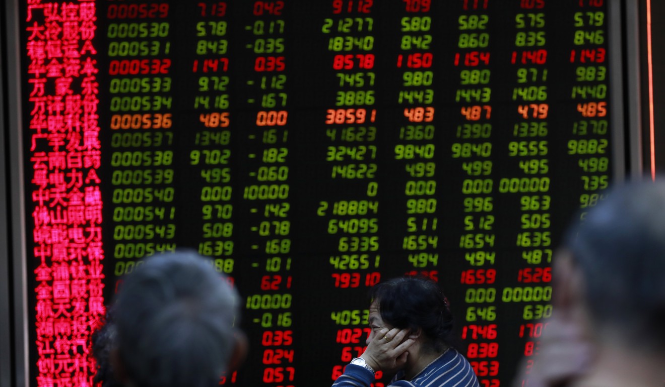 Equity price movements as represented at a securities brokerage in Beijing on November 2017. Photo: EPA