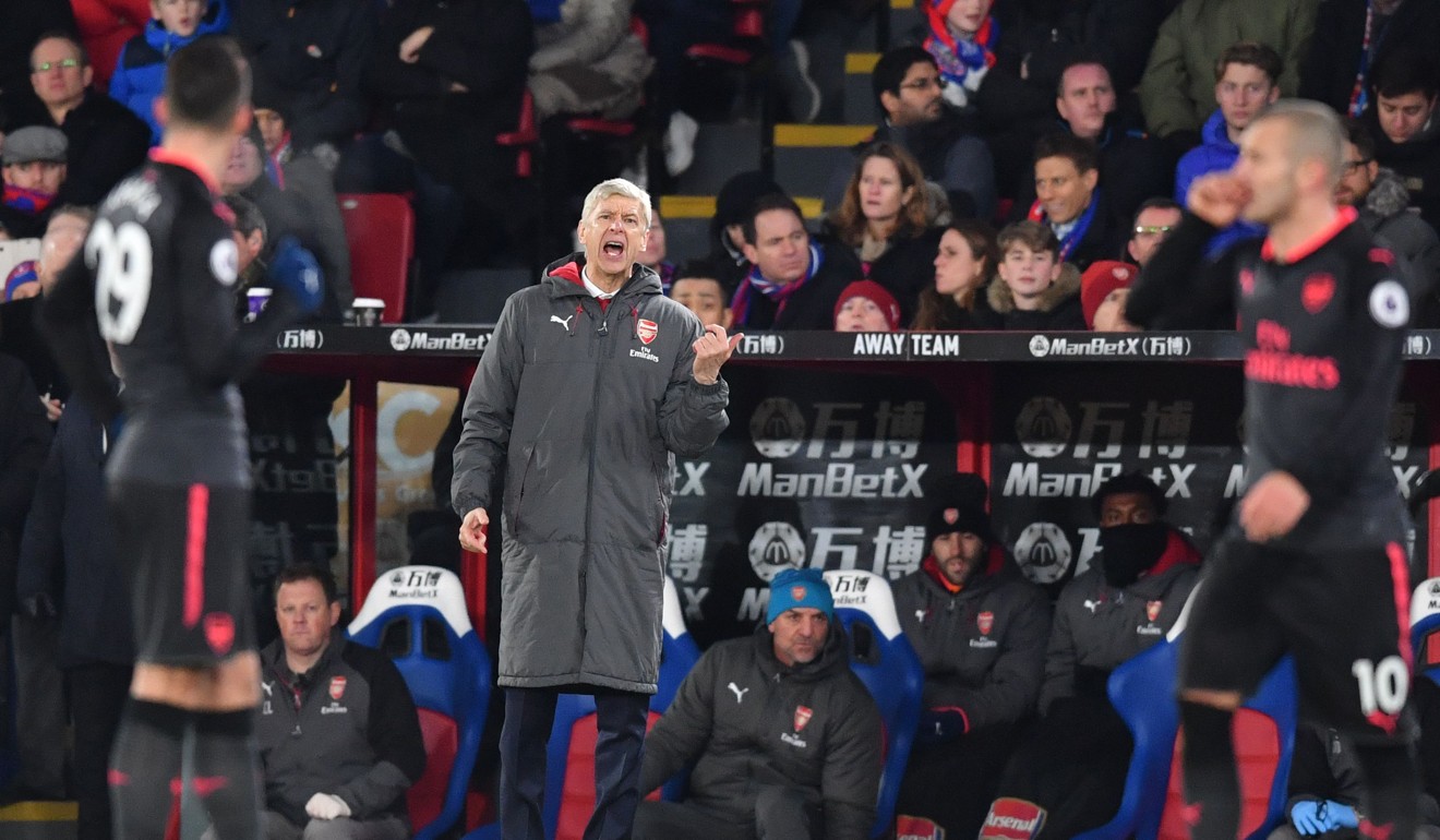 Arsene Wenger shouts instructions from the sideline. Photo: AFP