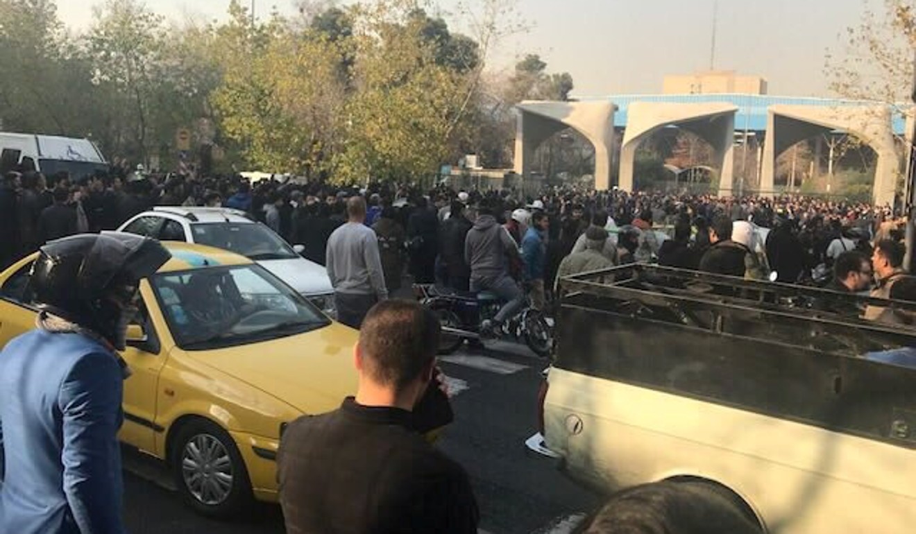 People protest near the university of Tehran. Photo: Reuters