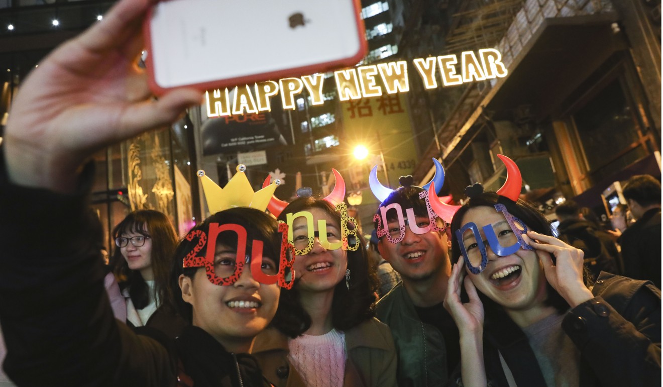 People celebrate on New Year’s Eve at Lan Kwai Fong in Central. Photo: Sam Tsang