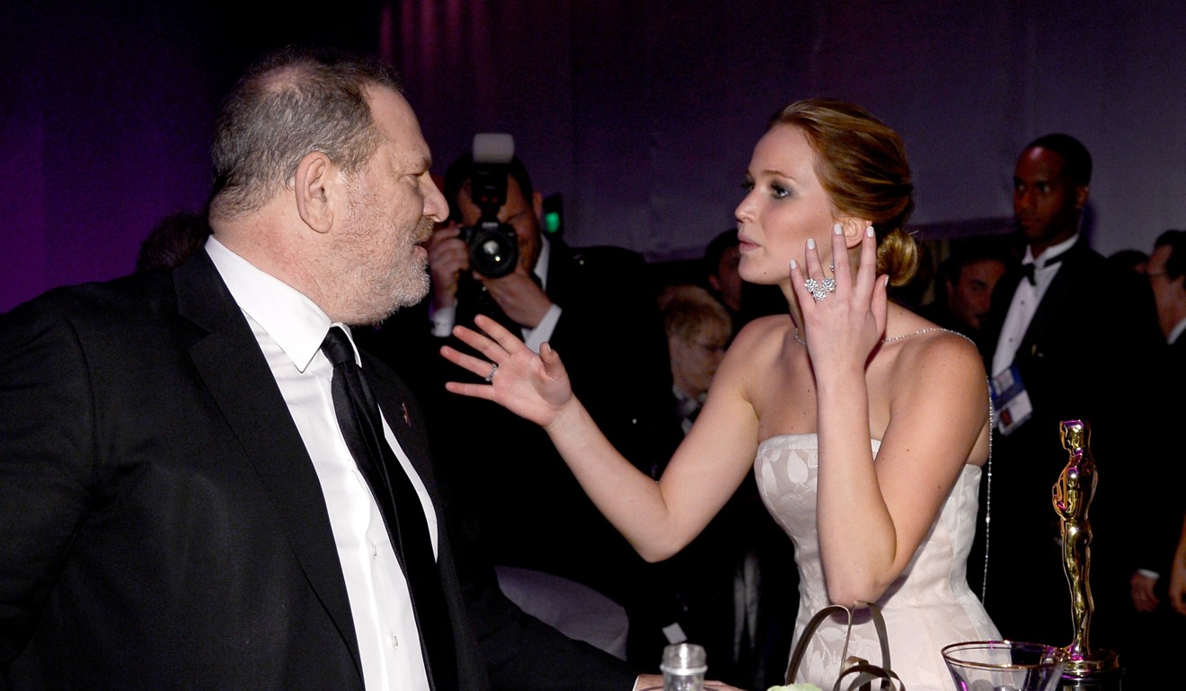 This file photo taken on February 24, 2013 shows actress Jennifer Lawrence talking to producer Harvey Weinstein as she attends the Oscars Governors Ball in Hollywood, California. Lawrence is among more than 300 top women in Hollywood who unveiled an initiative on January 1 to tackle pervasive sexual harassment in workplaces. Photo: Agence France-Presse