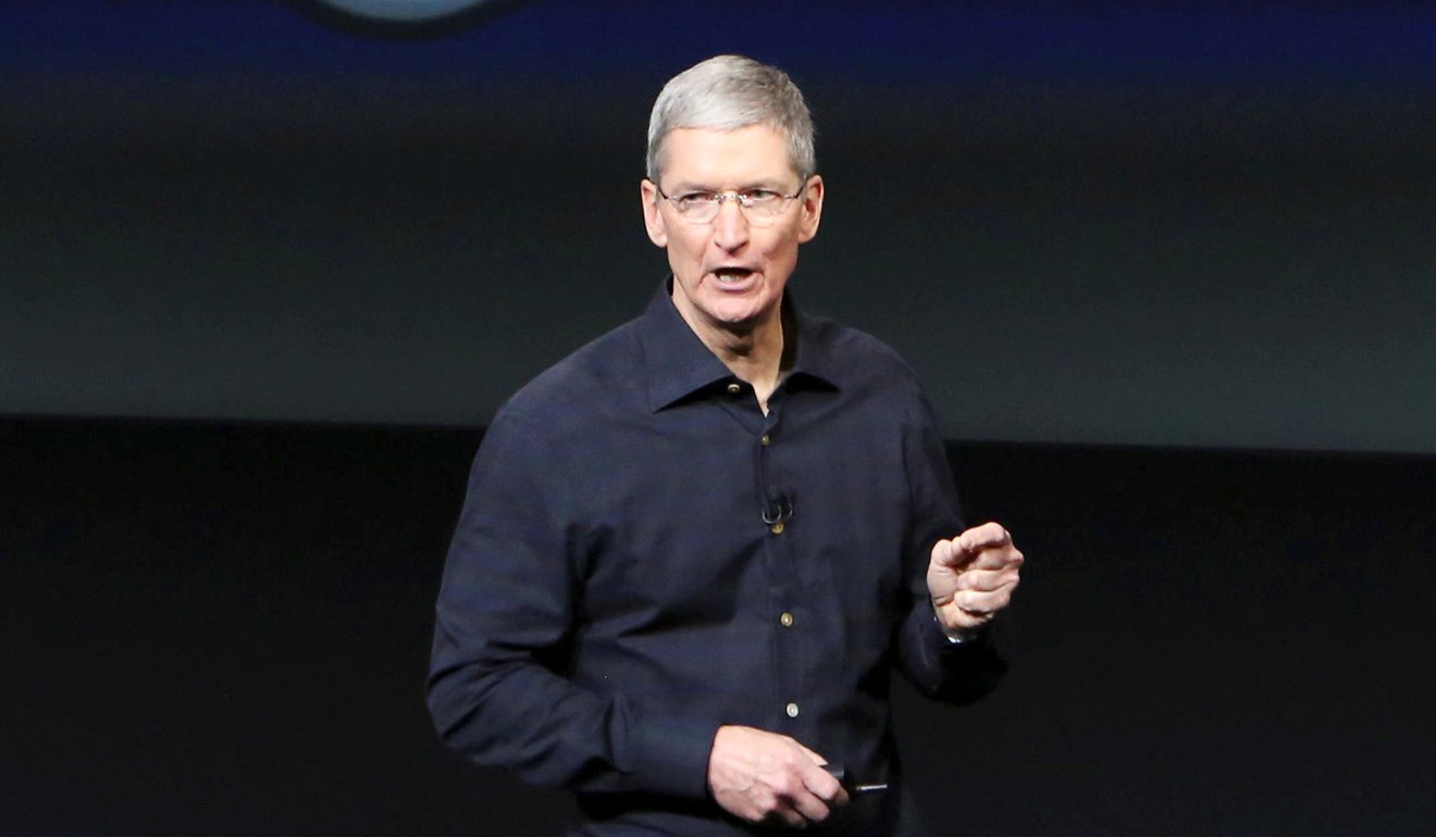 Apple CEO Tim Cook is seen here at a promotional event for the iPhone. Cook became CEO in 2011 and has earned less than Ahrendts since 2014. Photo: REUTERS