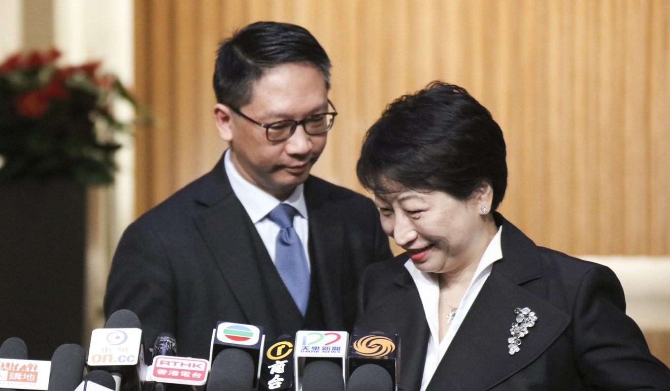 Outgoing justice minister Rimsky Yuen Kwok-keung (left) with Cheng on Friday. Photo: Felix Wong