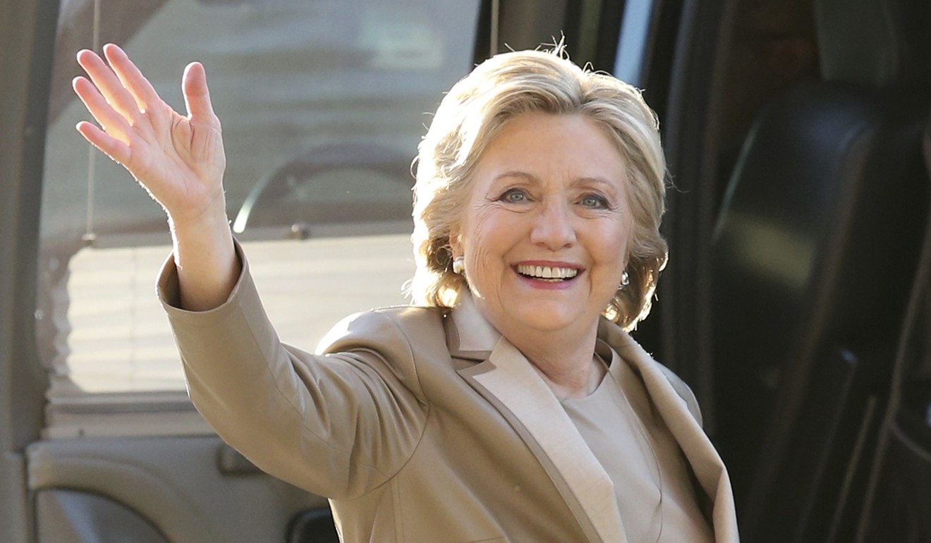 Hillary Clinton waves as she arrives to vote at her polling place in Chappaqua, New York. The FBI is investigating donations to the Clinton Foundation. Photo: AP