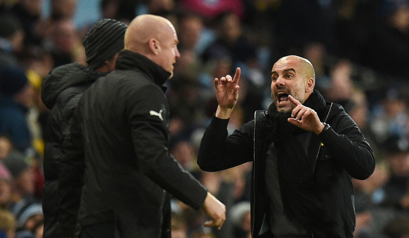 Guardiola gestures to Burnley's manager Sean Dyche during City’s win at the Etihad Stadium in Manchester. Photo: AFP