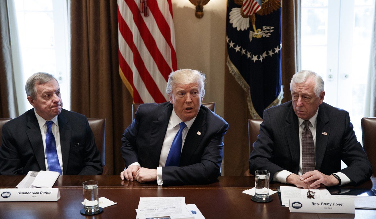 Senator Dick Durbin, left, and Representative Steny Hoyer, right, listen as US President Donald Trump speaks during a meeting with lawmakers on immigration policy in the Cabinet Room of the White House in Washington on Tuesday. Photo: AP