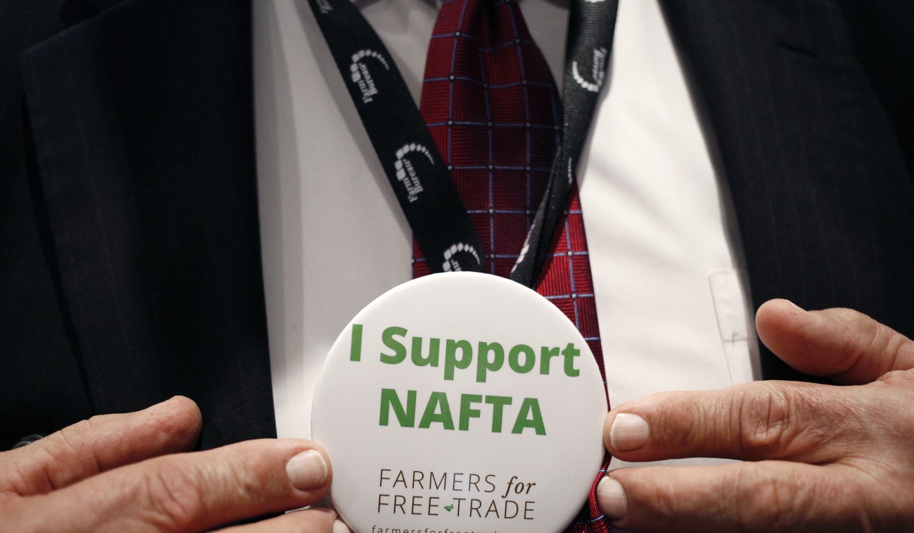 An attendee displays an “I Support Nafta” button for a photograph during the annual American Farm Bureau Federation conference in Nashville, Tennessee, on January 8, 2018. Photo: Bloomberg