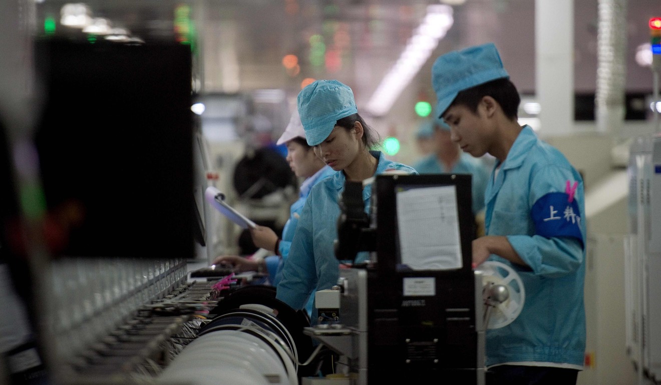 Workers at Chinese smartphone maker Oppo’s main factory, in Dongguan, in May last year. Photo: AFP