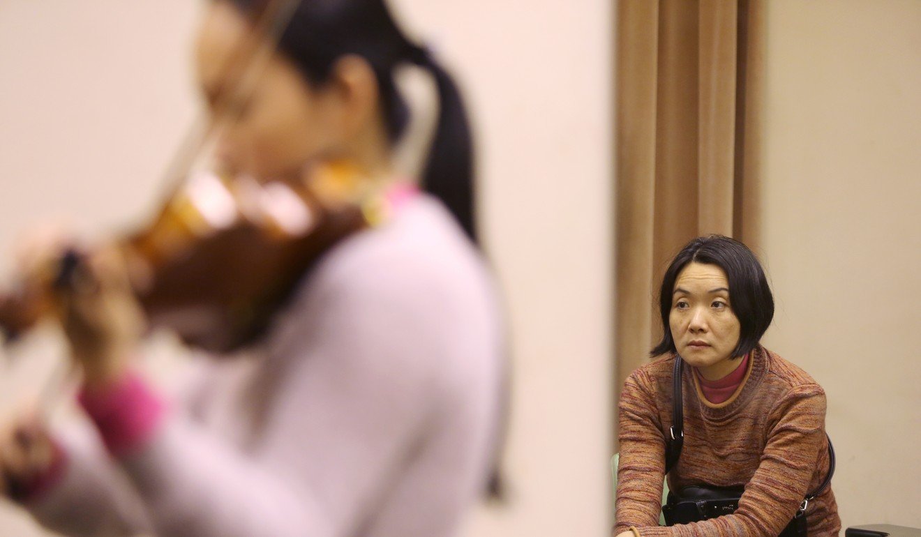 Wang watches her daughter practise. Photo: Xiaomei Chen