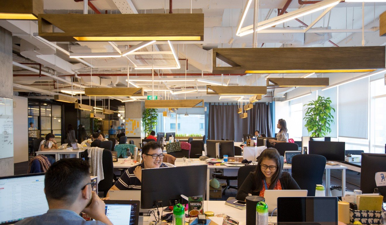 Employees work at the Traveloka Indonesia office in Jakarta, Indonesia. Embracing new technology and the digitalisation of traditional businesses in Indonesia has attracted foreign investors to companies like Traveloka Photo: Bloomberg