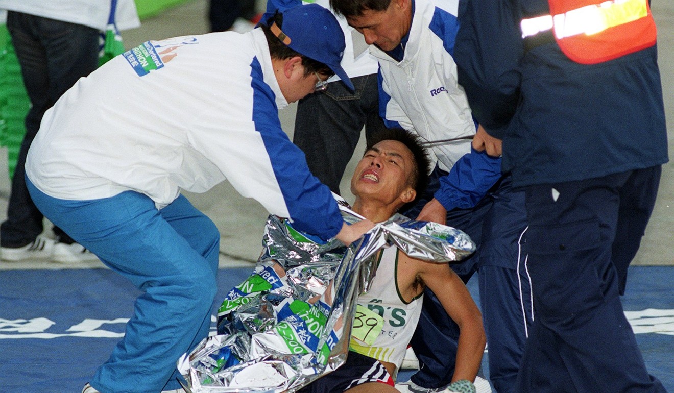 An injured athlete is attended to at the Hong Kong Marathon. Photo: David Wong