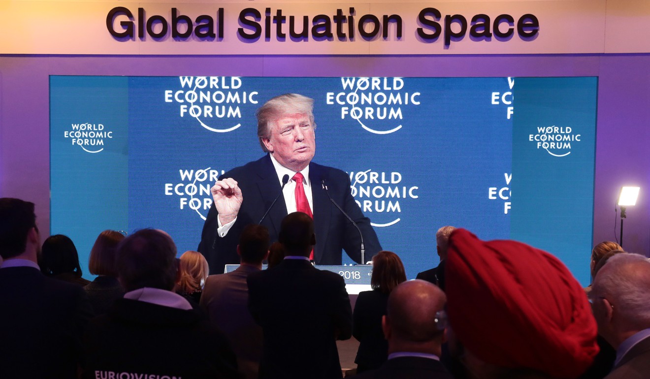 A television screen shows US President Donald Trump delivering a speech at the World Economic Forum (WEF) in Davos. Photo: Bloomberg