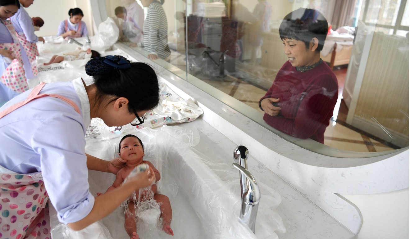 Staff bath babies in a postnatal confinement centre in Hefei, Anhui province, last month. Photo: Xinhua
