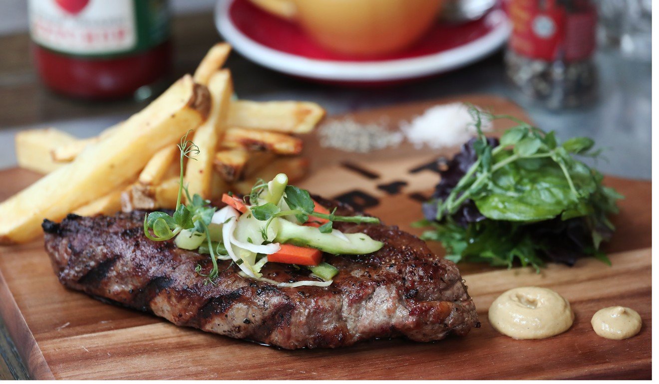 Dry-aged, grain-fed sirloin with fries. Photo: Jonathan Wong