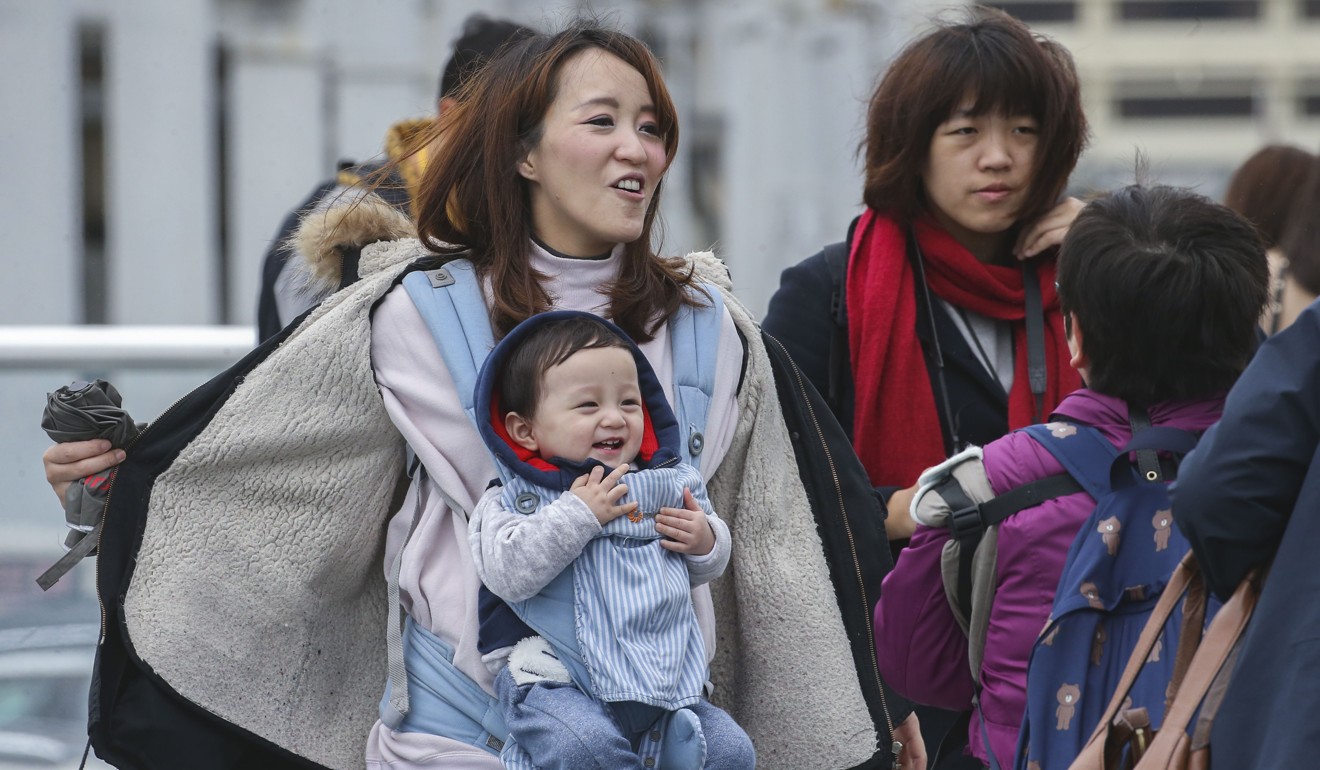 Parents are urged to keep their young children warm but not overheated. Photo: David Wong